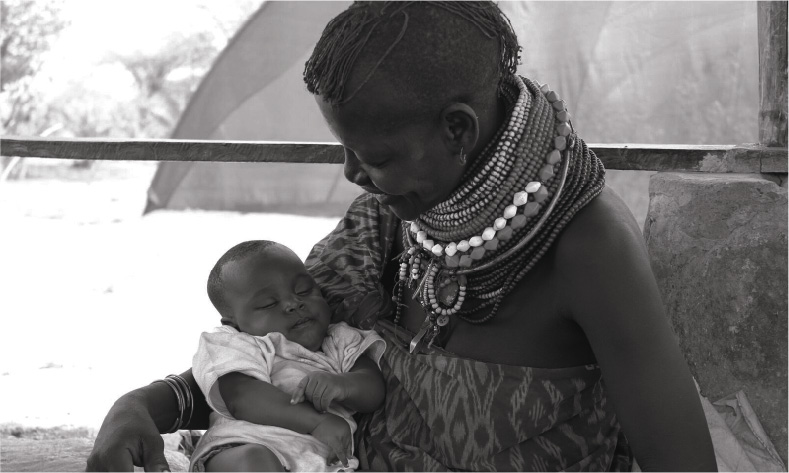 Kenyan mother with sleeping child